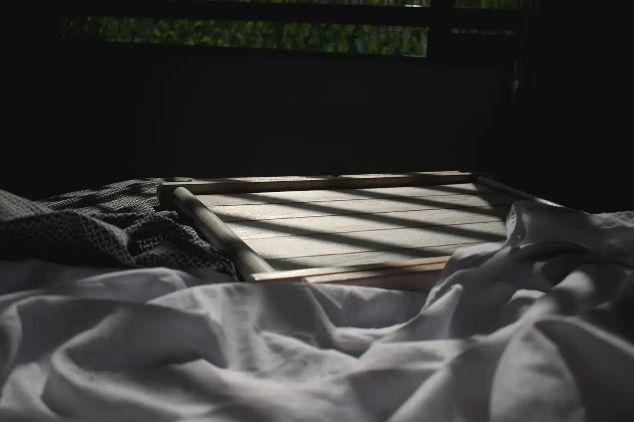 The bed at night, a line of light